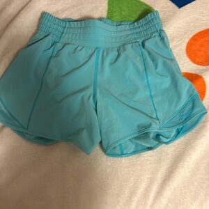 Lululemon Hotty Hots 
Size 4
Electric turquoise